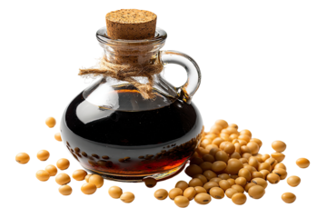 Soy sauce in a glass bottle, surrounded by soybeans