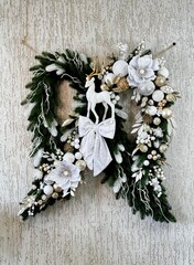 festive christmas wreath with deer and white bow