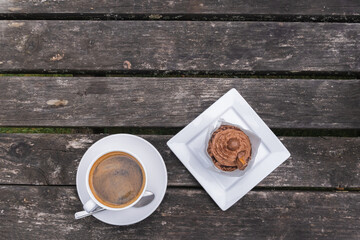 Relaxing break with coffee and cake outside. Sweet indulgence. Suitable for lifestyle, hospitality photography. Cozy break. Single in a quiet landscape
