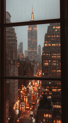 A view of the metropolis from a window during rain