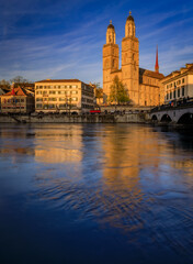 Zurich Cityscape with Limmat River and iconic Grossmunster cathedral Switzerland