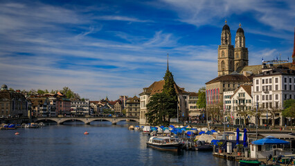 Zurich Cityscape with Limmat River and iconic Grossmunster cathedral Switzerland