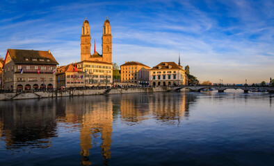 Zurich Cityscape with Limmat River and iconic Grossmunster cathedral Switzerland