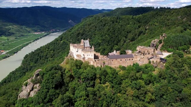 Austria tourism. Aggstein Castle, scenic Wachau valley with stunning view of Danube river. aerial drone footage.
Fortress one of the most famous castle ruins in Austria. 