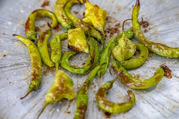 Mix of green peppers Shishito pepper Capsicum Annuum japonsea, or Japanese sweet pepper, not spicy and very tasty and Cambuci pepper Capsicum baccatum, green bell-shaped pepper