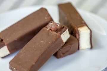 Delicious luxury gourmet ice creams in the shape of an Italian-style sandwich with chocolate topping