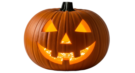 A traditional carved halloween pumpkin with a bright, illuminated face, isolated on a transparent background