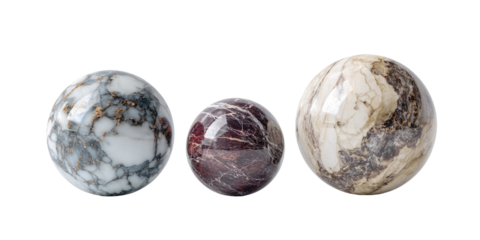 Three polished stone spheres in various marbleized patterns