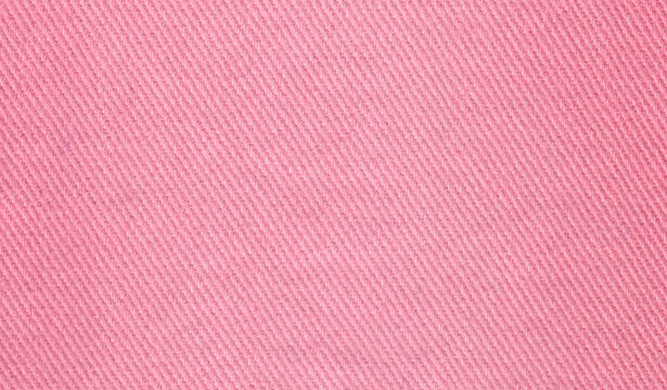 Denim jeans texture. Pink denim background texture for design. Canvas denim texture. Warm color denim that can be used as background. Blue jeans texture for any background.
