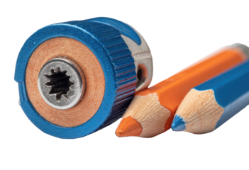 Close-up of a pencil sharpener and two colored pencils.  The sharpener, with a blue anodized metal casing, has a small, finely-tooled, metal hole.  A section of the wood of the pencils is visible,