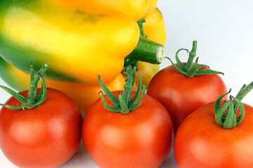 Ripe red tomatoes on a white background. 