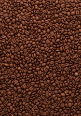 Close-up view of numerous coffee beans, showcasing their rich brown tones and intricate details.
