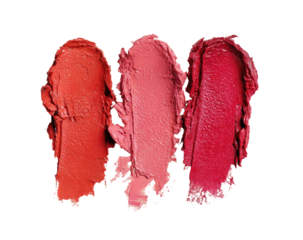 Three swatches of lipstick, ranging from coral-red to a deep rose, against a black background.  Each swatch shows a textured, smudged application