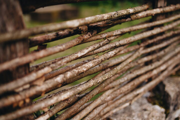 Fototapeta premium Rustic Woven Wooden Fence Close-up View
