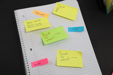 sticky notes stuck to a school notebook written on them student teacher school homework