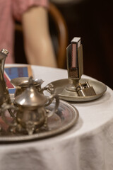 A detail of a metal match holder.
