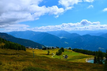 View of Emberger Alm mountain pasture in Kreuzeck group with a view Gailtal Alps in Carinthia, Austria
