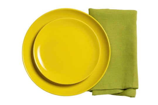 Yellow dinner plates and a lime green napkin