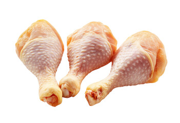 Three raw chicken drumsticks, close-up, isolated on white