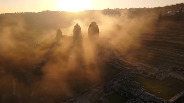 Misty sunrise over ancient inca ruins in the andes mountains