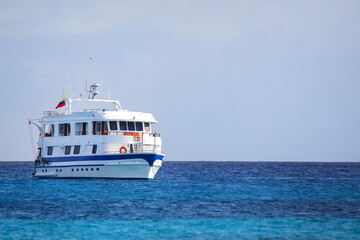 Fototapeta premium Typical tourist yacht anchored at Gardner Bay, Espanola Island, Galapagos National park, Ecuador.
