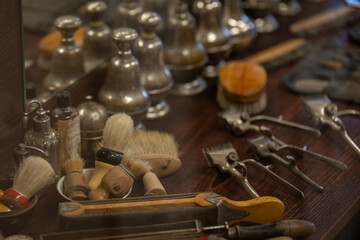 A view of brushes and cutting tools in a barber shop from the First Republic era.
