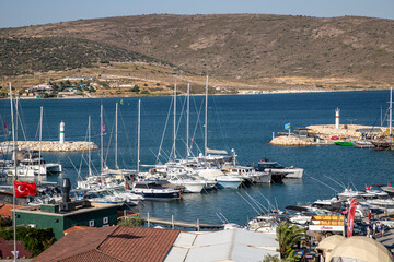 Various yachts anchored in the harbor. A small district harbor. Alaçatı, Çeşme, Izmir