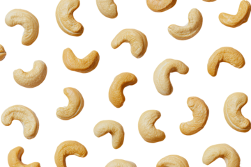 Cashew nuts scattered on black background