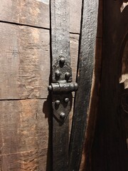 A detail of medieval ironwork on a barrel.
