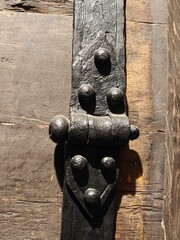 A detail of medieval ironwork on a barrel.
