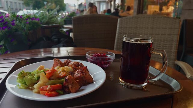 Enjoy an exceptional outdoor dining experience featuring a colorful meal paired with a refreshing beverage