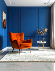 Contemporary living space showcasing a striking contrast between a bright orange armchair and a sophisticated deep blue paneled wall
