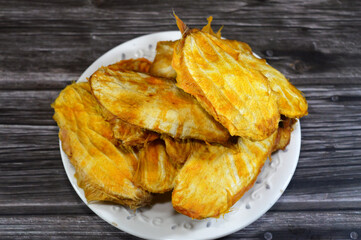 mango pits, the large, woody seed at the center of a mango, surrounded by the fruit's flesh, the real seed inside the pit can be planted to grow a mango tree, mango seed or gutli, flat, inedible seeds