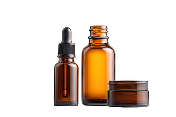 Three amber glass bottles and a jar, showcasing cosmetic products