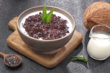 Bubur ketan hitam, bubur injit, bubur pulut hitam. Black sticky rice porridge is a dessert, with a sweet taste, made from sticky rice boiled with excess water until soft, and usually served with cocon