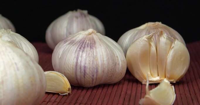 Garlic - vegetable with many beneficial properties for health. Antiseptic, fights microbes and pathogens, indicated for viral diseases. Allium sativum, species of bulbous plants in genus Allium