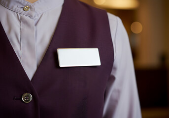 Blank Name Tag on a Hotel or Restaurant Employee's Vest