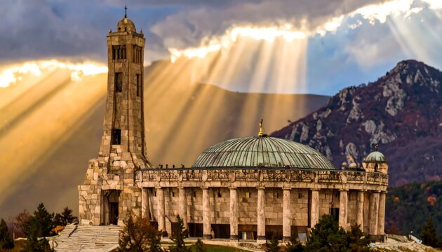 Majestic monument under dramatic skies at sunset