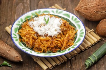 Sawut or pasrah is a snack made from coarsely grated cassava, then steamed until cooked, eaten with grated coconut.