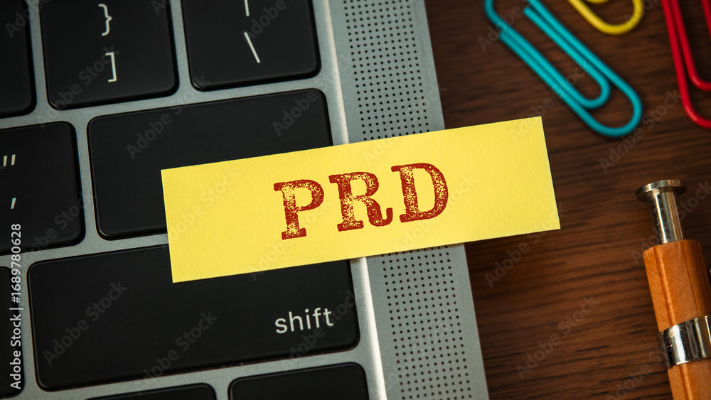 Poster there is sticky note with the word prd. it is an abbreviation for product requirements document as e