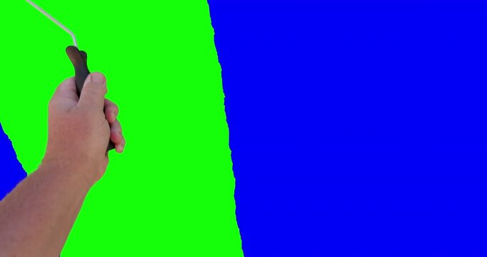 Male Hand Using Paint Roller to Paint Entire Screen From Green Screen to Blue Screen.