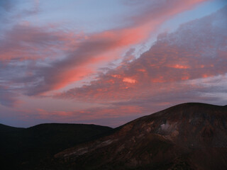 Dramatic Sunset Sky with Pink Clouds over Mountain Landscape
