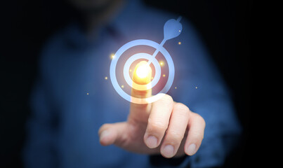 Business success concept with businessman finger touching glowing target dartboard, symbolizing goal achievement, precision, leadership, and ambition. Perfect for corporate growth and strategy.