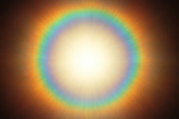 A radiant circular rainbow lens flare with a bright central glow, creating a captivating abstract light effect on a grainy, dark background, suitable as an isolated illustration.