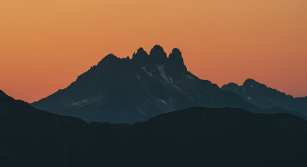 Fototapeta premium Beautiful mountain silhouette against dramatic sky, scenic landscape view with nature horizon, minimal and peaceful outdoor background for travel and adventure concept.