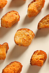 Dry baked small pieces of bread sprinkled with paprika,delicious snack