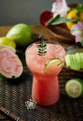 Red fruit drink with lemon slices in a glass,Psidium guajava