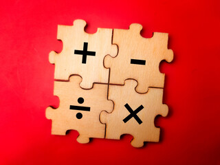 The image shows four wooden puzzle pieces that together form a square. Each piece features a...