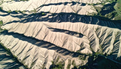 Aerial View of Beige Sand Dunes with Parallel Ridges