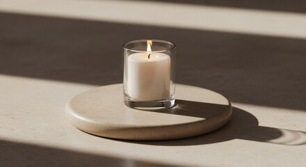 A Lit Candle in Glass Holder on Round Wooden Tray, Sunlight Streaming Through Window